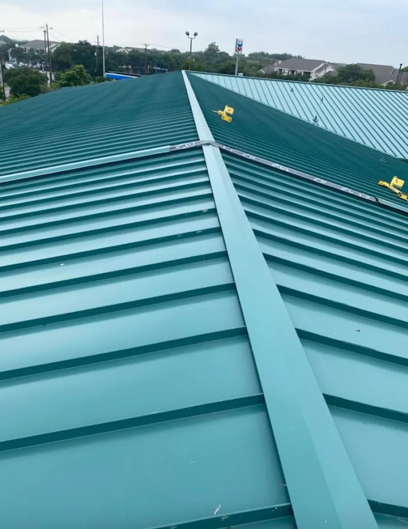 Green commercial metal roof ridge and valley for Metal Roof Repair in Ada
